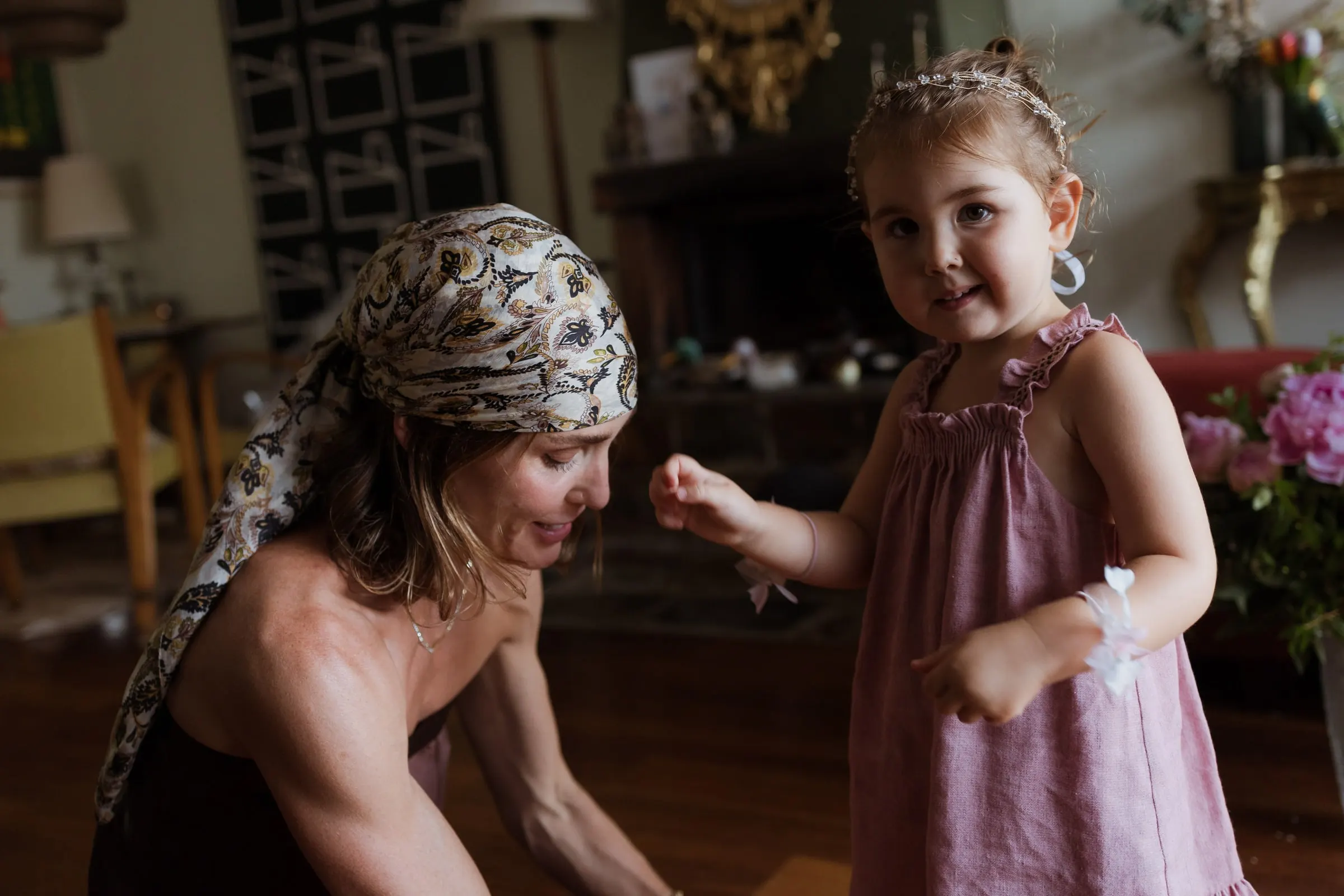 Woman in a headscarf playing with a little girl in a pink dress, Barbillón, Marbella