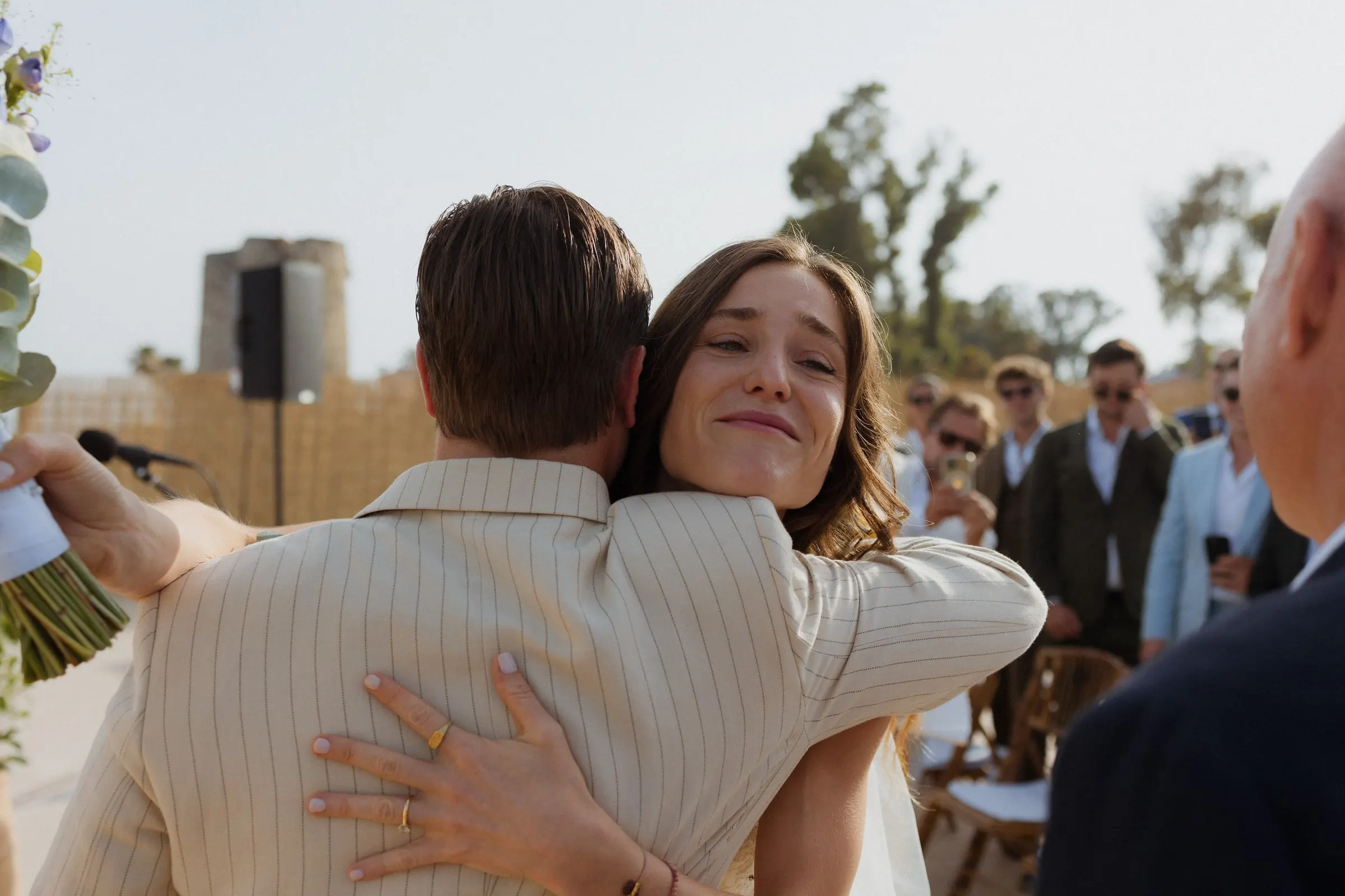 Bride hugging the groom tightly during the ceremony, eyes full of emotion, Barbillón, Marbella