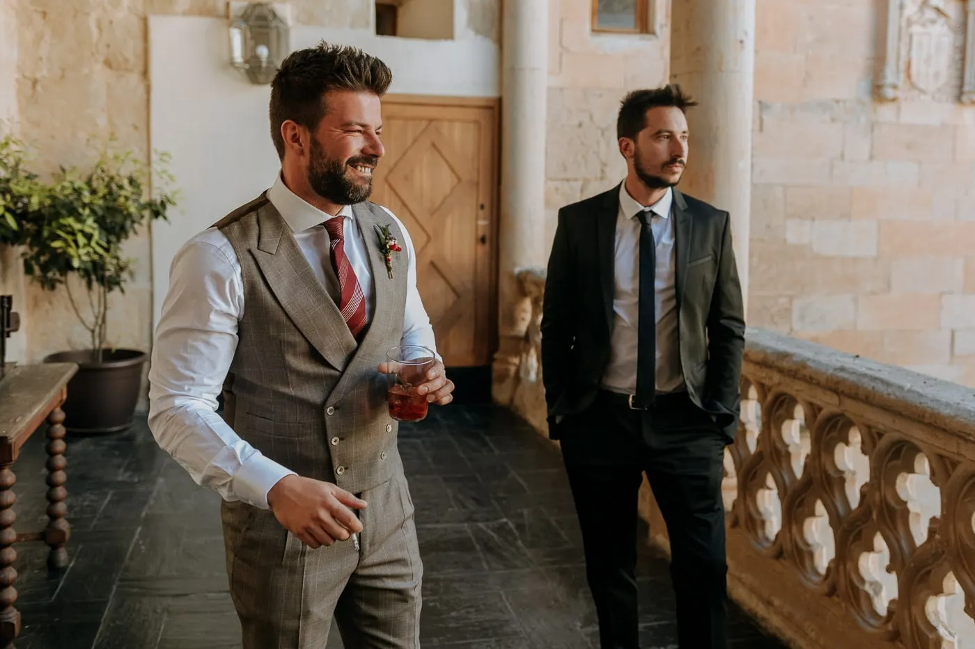 The grooms smiling on the gallery with its carved stone balustrade, Salamanca