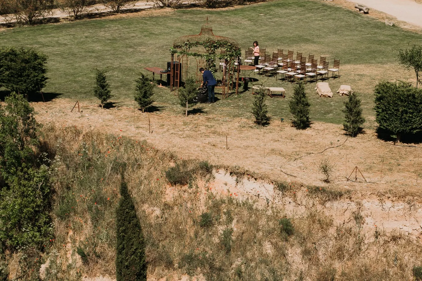 Ceremony set up in the meadow below the castle, seen from the walls, Castillo del Buen Amor