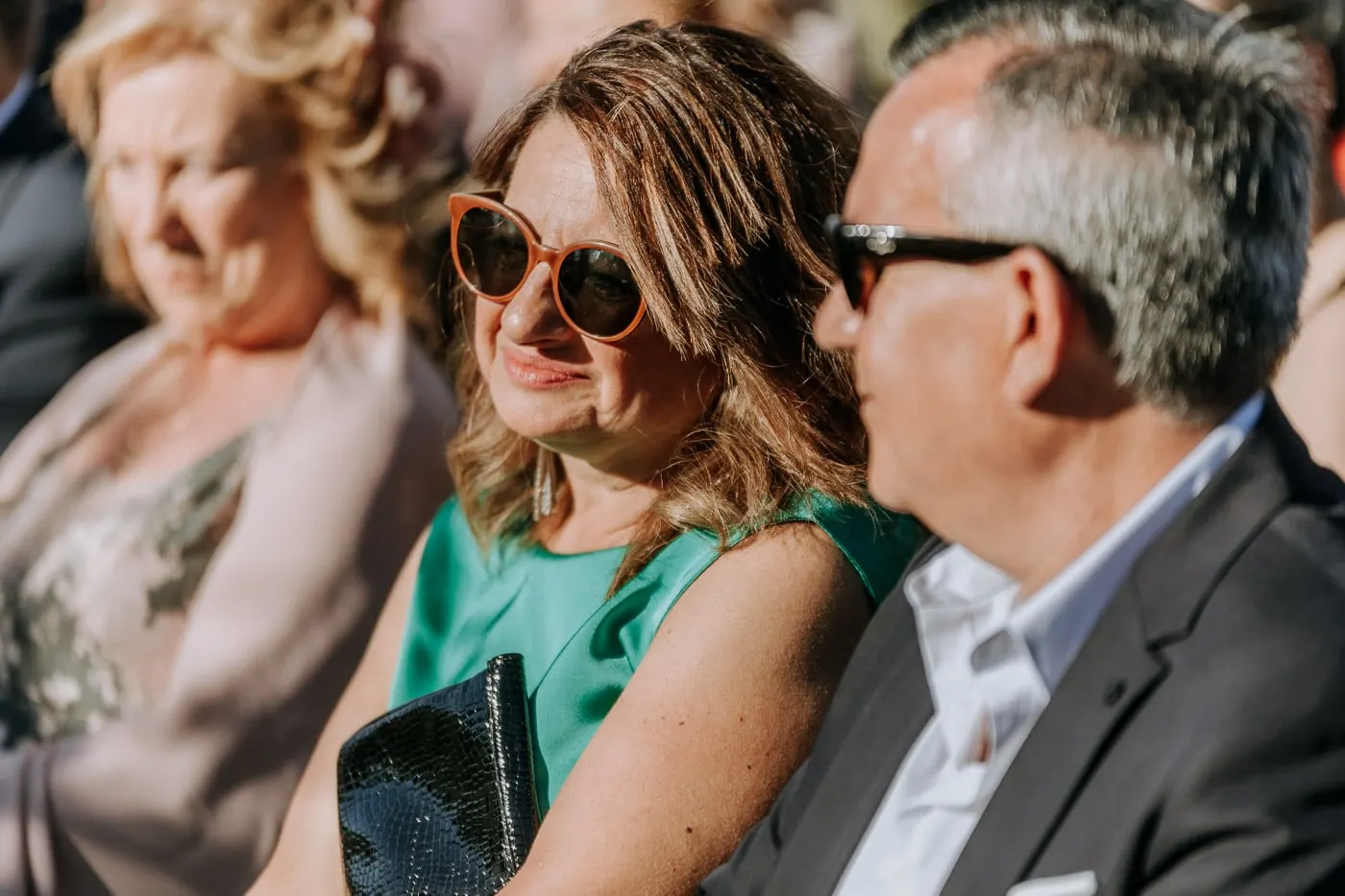 Guests in sunglasses listening to the ceremony, Salamanca