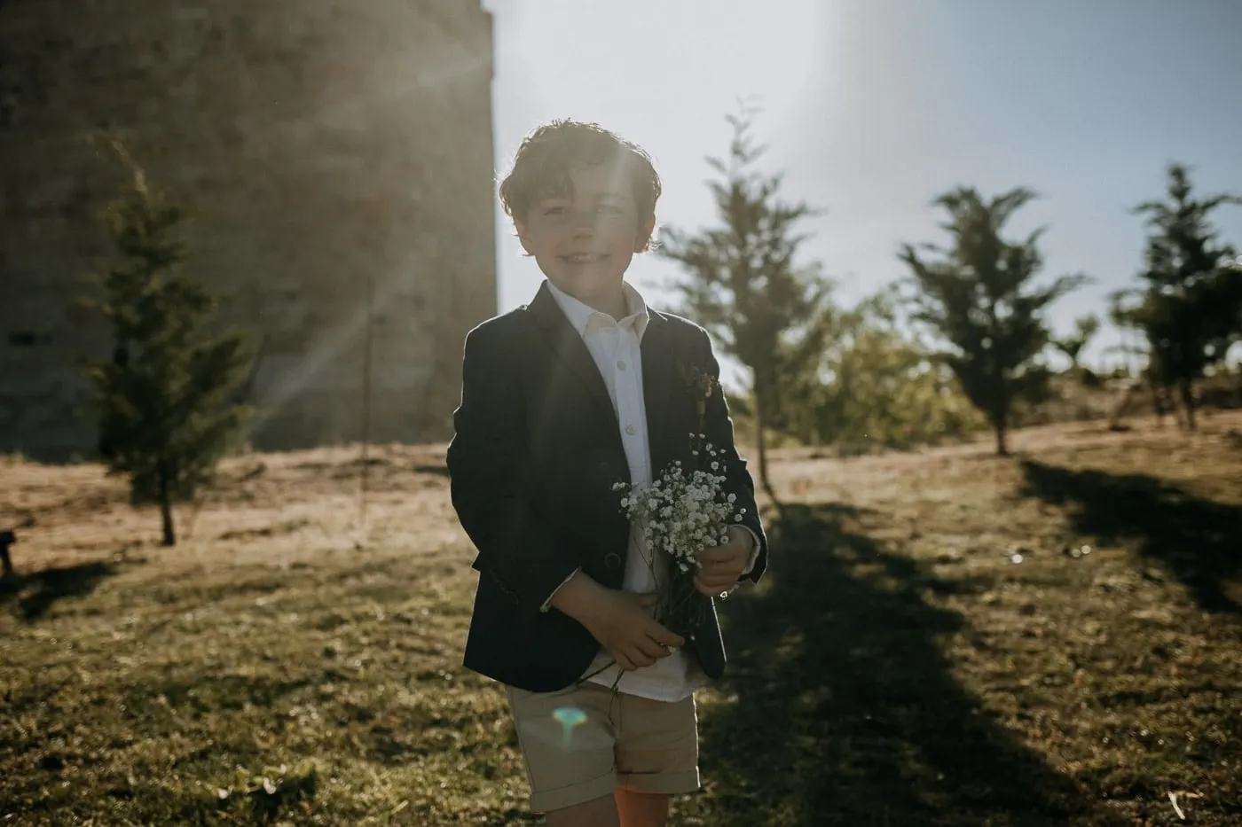 Little boy with a posy of gypsophila in the backlight, Salamanca