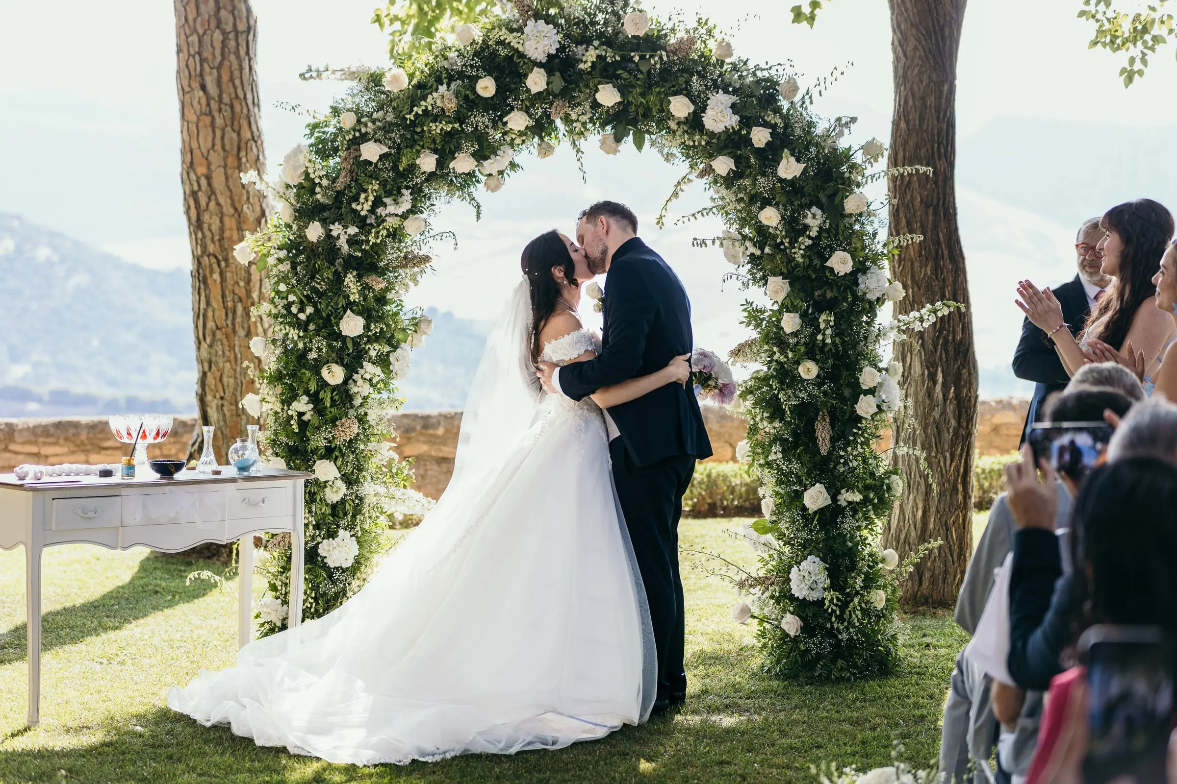 First kiss under the white flower arch at the Hotel Catalonia Reina Victoria, Ronda