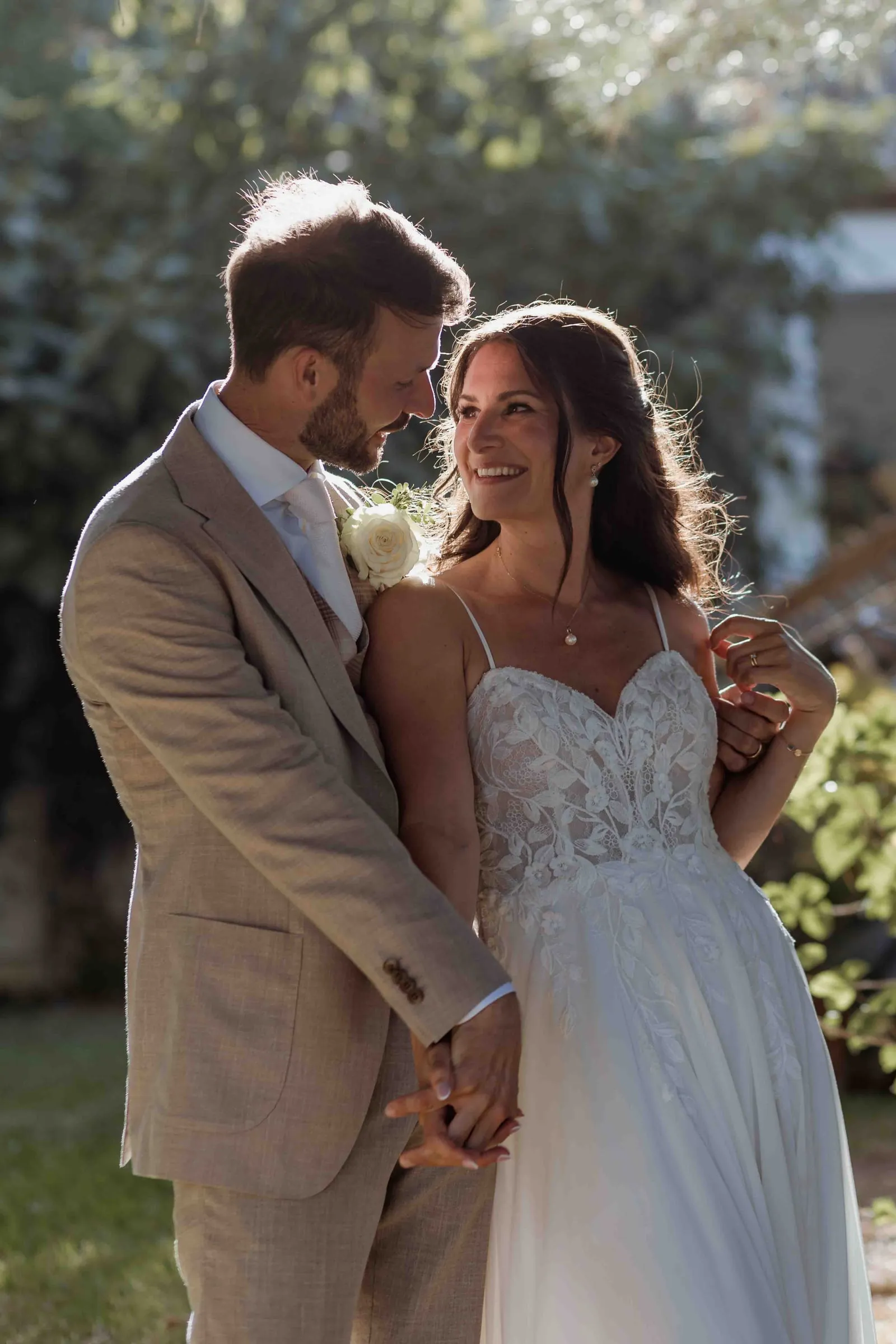 Bride and groom laughing in the sun at Hacienda San José, Mijas