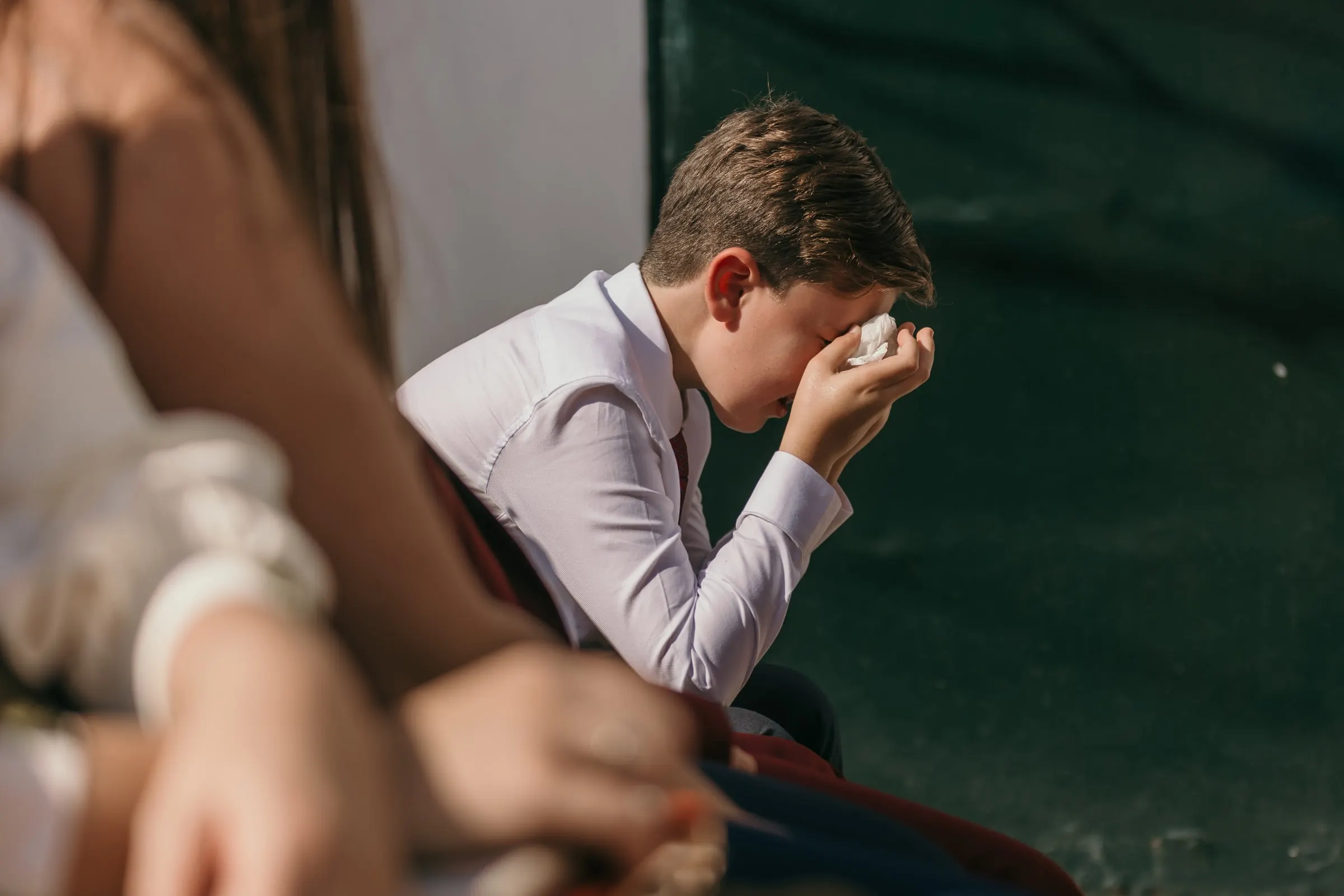Guest wiping away tears during the speeches at an Andalusian cortijo wedding