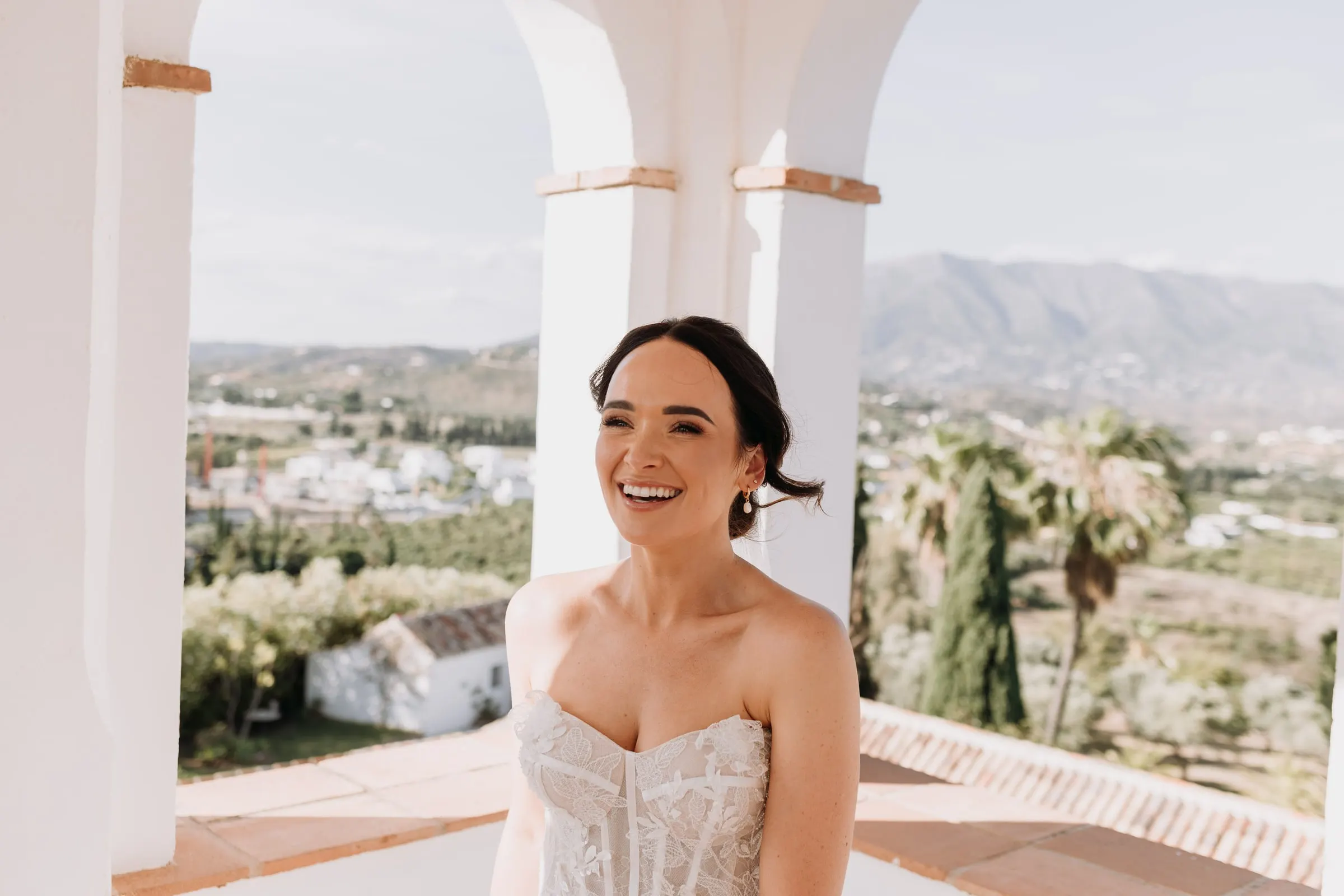 Close portrait of the bride against the arches and the valley, Mijas