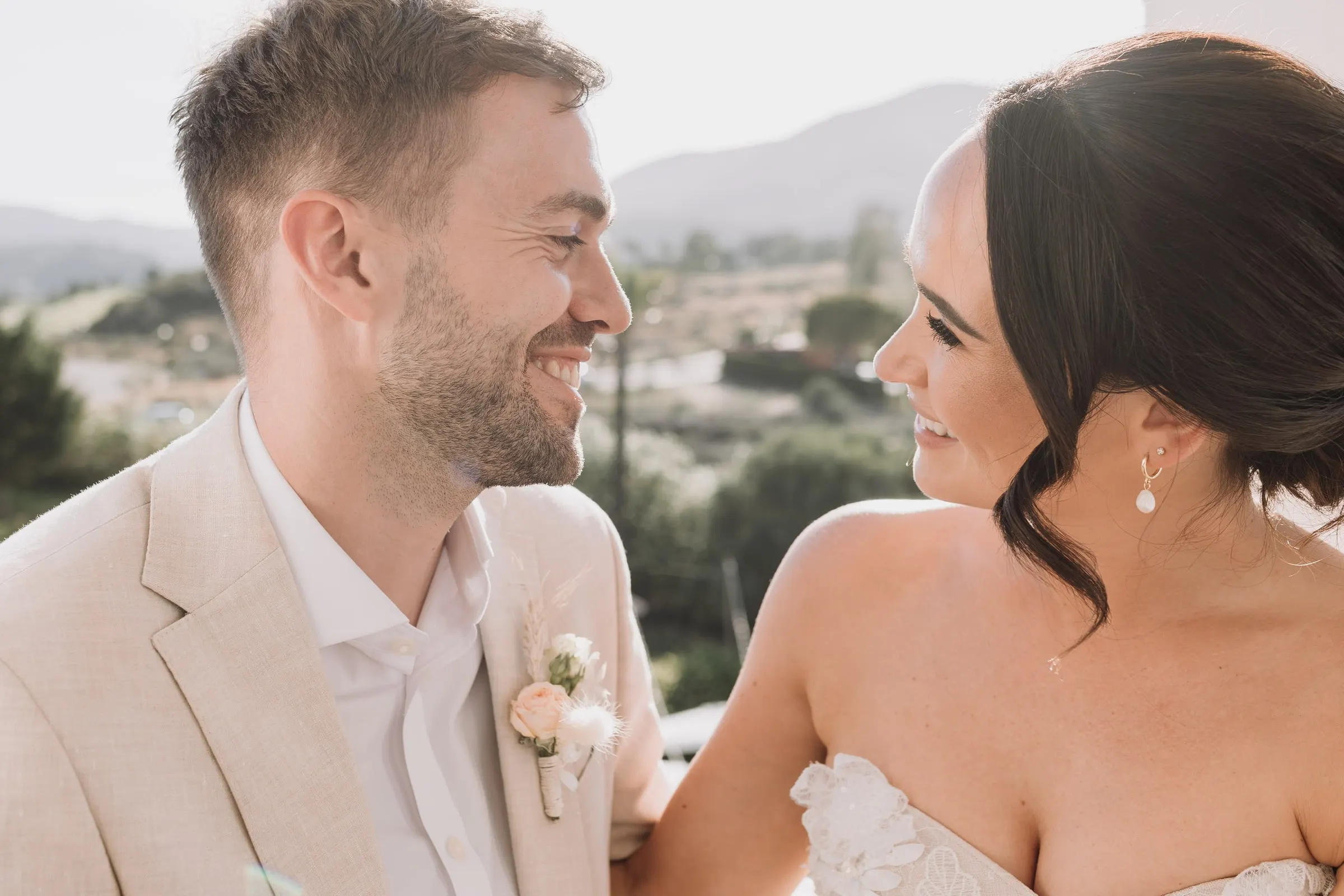 Close-up of the bride and groom smiling at each other, Hacienda San José