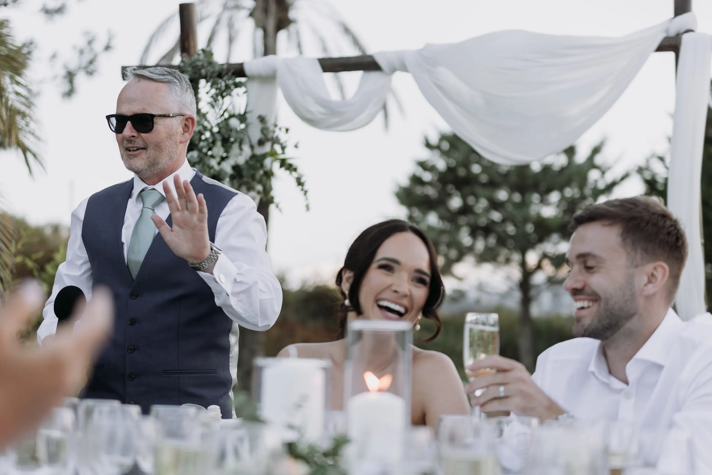 Father of the bride giving his speech as the couple laugh, Hacienda San José