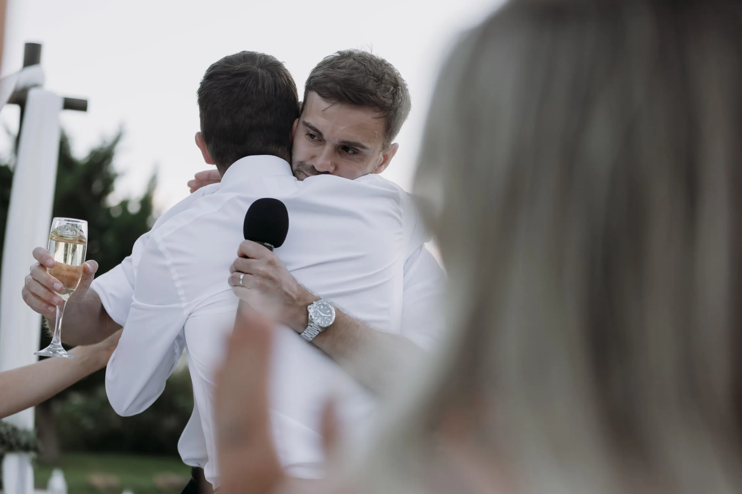 Groom hugging a friend after the speeches, Mijas