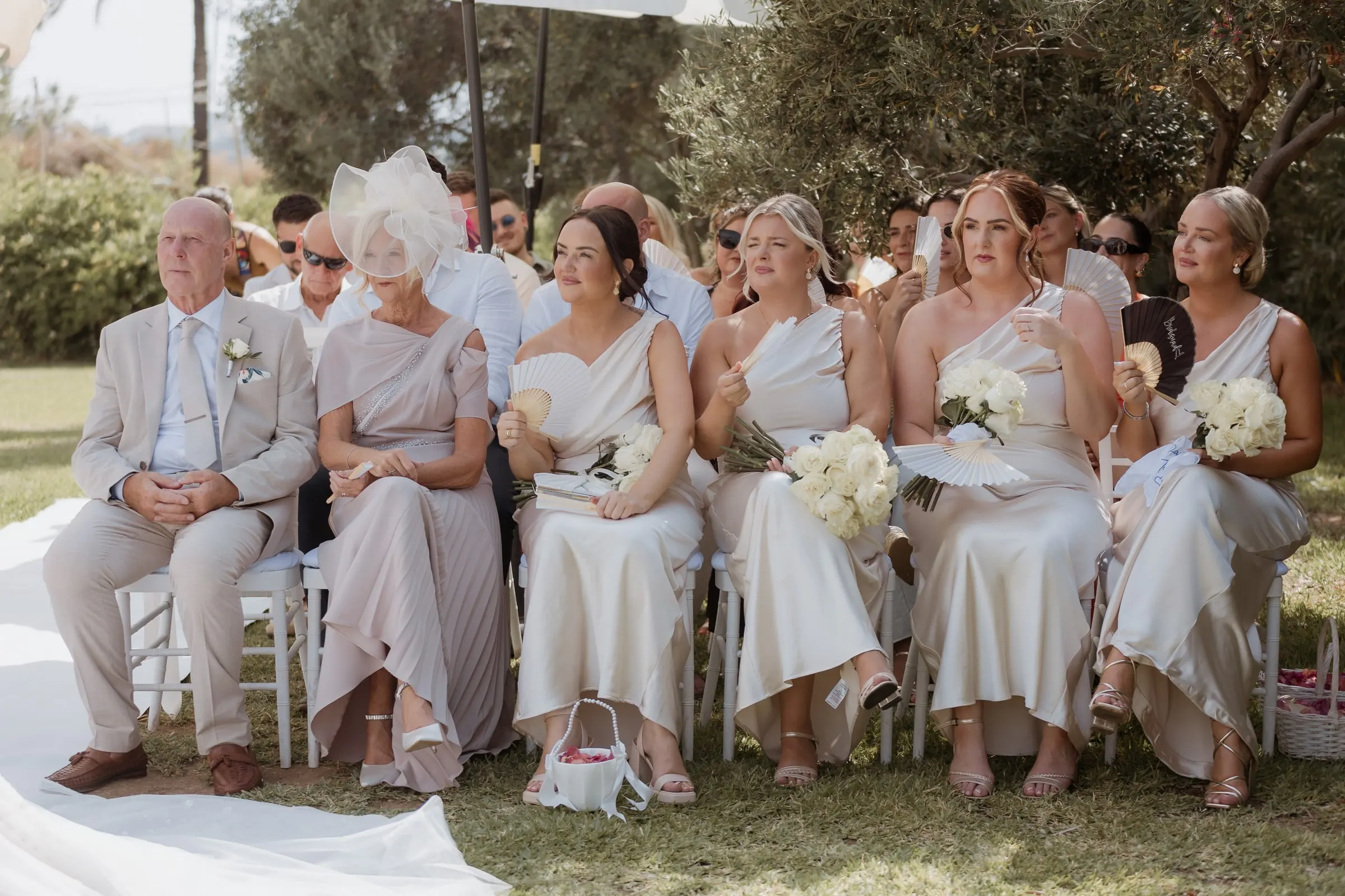 Family in the front row watching the ceremony in the garden in Mijas
