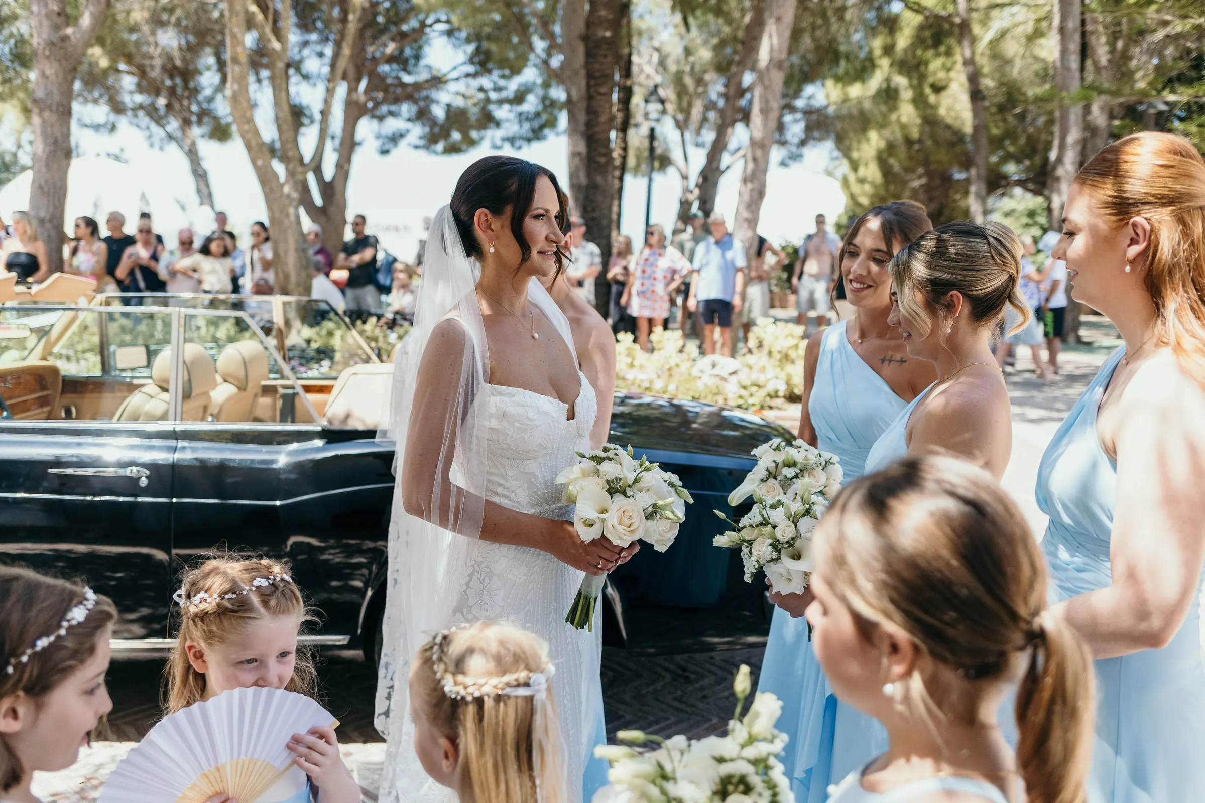 Bride arriving at the church in Mijas Pueblo with the flower girls