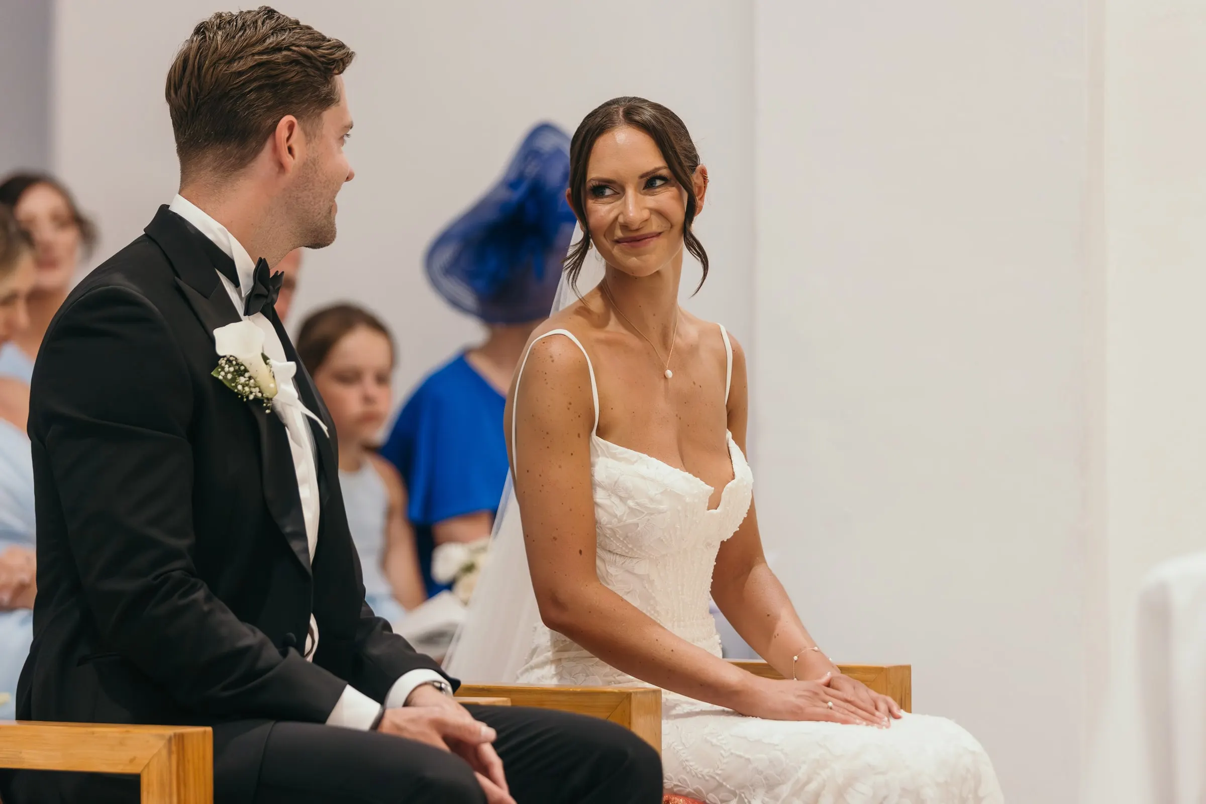 Bride and groom smiling at each other at the altar in Mijas